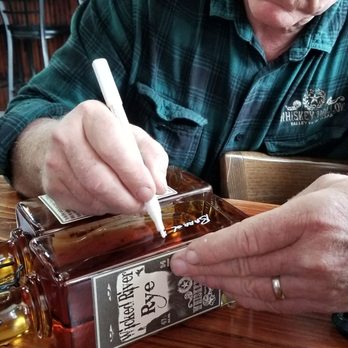 Whiskey Hollow - Here is Les signing the #7 bottle if the #1 barrel of rye! - Distilleries Near Me - Valley View, Texas