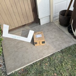 US Post Office - Package left RIGHT in the middle of a WET PAINT area! I mean, WTF?! This postal carrier is a complete idiot.