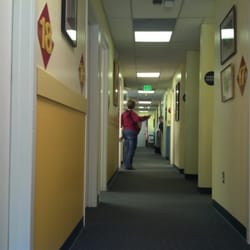 Vestavia Pediatrics - Yellow hallway (one of three color coded hallways) with exam rooms on the left and offices on the right
