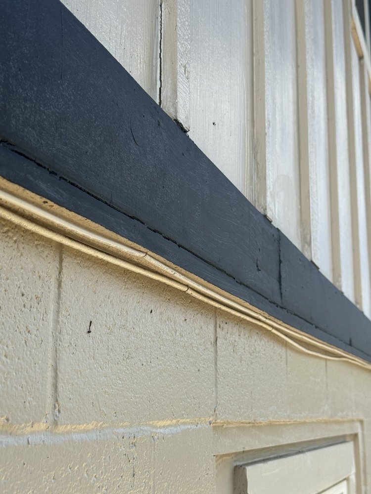 Slide of J&E ROOFING