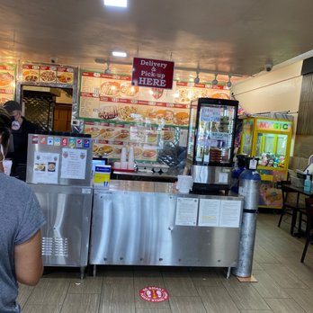 Tacos Mexicanos - a woman standing in front of a counter - Mexican Near Me - Buena Park, California Tacos Mexicanos - a woman standing in front of a counter - Mexican Near Me - Buena Park, California