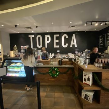 Topeca Coffee - a woman sitting at the counter - Coffee & Tea Near Me - Tulsa, Oklahoma