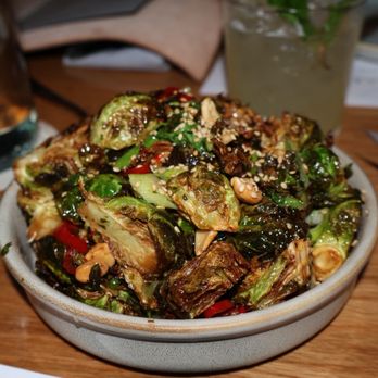 Sixty Vines - BRUSSELS crispy fried, kung pao vinaigrette, scallions, toasted sesame seeds, cashews - Wine Bars Near Me - Winter Park, Florida Sixty Vines - BRUSSELS crispy fried, kung pao vinaigrette, scallions, toasted sesame seeds, cashews - Wine Bars Near Me - Winter Park, Florida