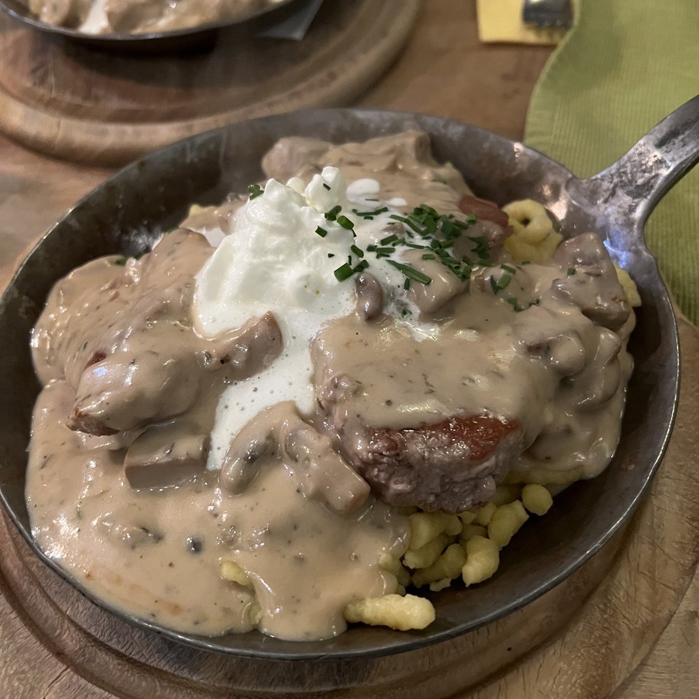 Gaststätte Trödelstuben - Pork medallions with a mushroom cream sauce served on spatzle. OMG so good! - German Near Me - Nuremberg, BY