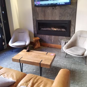 Zeroday Brewing - Cozy fireplace seating with sofa. - Breweries Near Me - Harrisburg, Pennsylvania