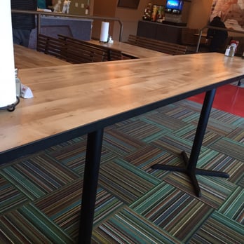 Ezell's Famous Chicken - Standing table in the middle of the dining area - Southern Near Me - Bellevue, Washington Ezell's Famous Chicken - Standing table in the middle of the dining area - Southern Near Me - Bellevue, Washington