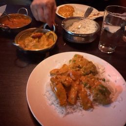 Butter chicken and coconut curry with plain naan.