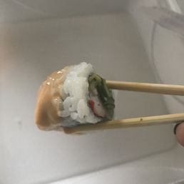 California roll dipped in spicy mayo California roll dipped in spicy mayo