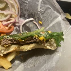 The All American Steakhouse & Sports Theater - "1/2 lb angus burger"- not as advertised on menu