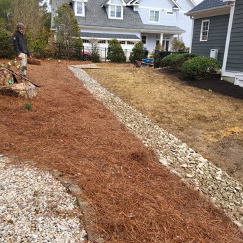 T3 Landscaping - During photo of a french drain wrapped in pine straw - Junk Removal & Hauling Near Me - Pittsboro, North Carolina T3 Landscaping - During photo of a french drain wrapped in pine straw - Junk Removal & Hauling Near Me - Pittsboro, North Carolina