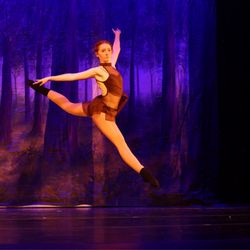 Studio D - Dancer catching air in Studio D's production of Tales of the Forest.