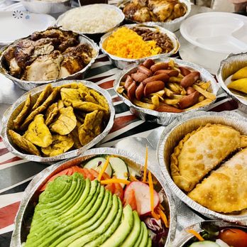 Super  Pollo  Restaurant - table full of food - Spanish Near Me - Ridgewood, New York