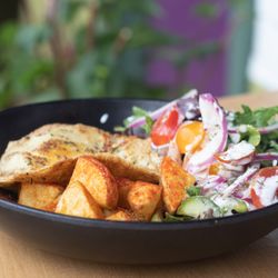 Julia's Vegetarian Restaurant - Brunch bowl with crispy paprika potatoes, regular or vegan egg and salad