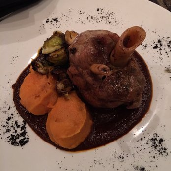 Caracol - Slow-Roasted Pork Shank with mole costeno, fire-roasted sweet potatoes, and Brussel sprout leaves (5 stars) - Seafood Near Me - Houston, Texas Caracol - Slow-Roasted Pork Shank with mole costeno, fire-roasted sweet potatoes, and Brussel sprout leaves (5 stars) - Seafood Near Me - Houston, Texas
