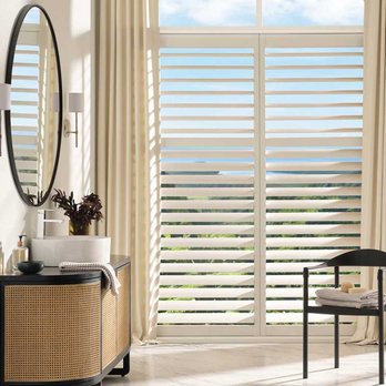 A Shade Above - Motorized Palm Beach™ PolySatin™ Shutters respond to the touch of a button on a remote or phone, easily adjusting the lighting and views. - Shutters Near Me - Charlotte, North Carolina