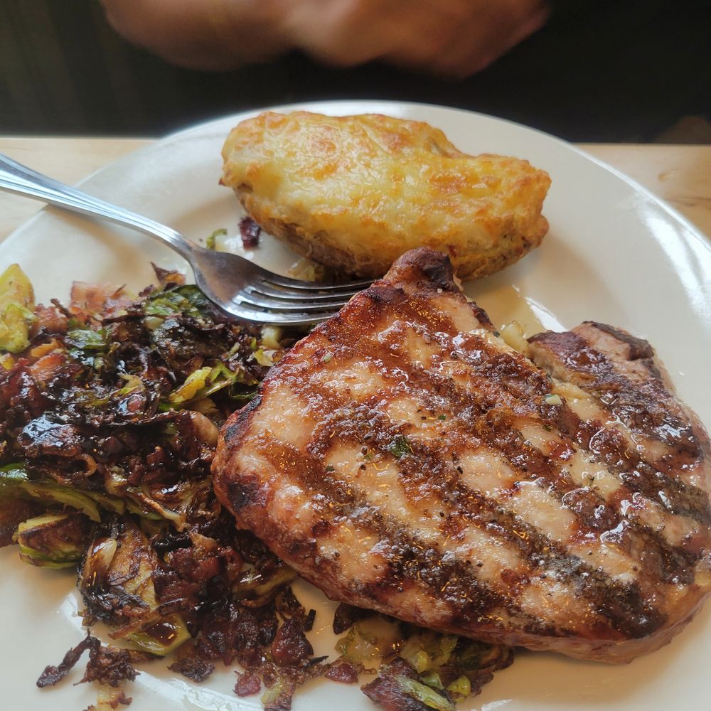 Alisson's Restaurant - Pork with brussel sprouts and a twice baked potato - Seafood Near Me - Kennebunkport, Maine