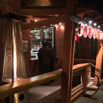 Pye Hole - people standing outside a restaurant at night - Pizza Near Me - Bellingham, Washington Pye Hole - people standing outside a restaurant at night - Pizza Near Me - Bellingham, Washington