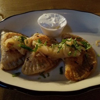 Hudson Hall - Pierogi (potato and cheese filling, topped with caramelized onions and cilantro) - Beer Bar Near Me - Jersey City, New Jersey Hudson Hall - Pierogi (potato and cheese filling, topped with caramelized onions and cilantro) - Beer Bar Near Me - Jersey City, New Jersey