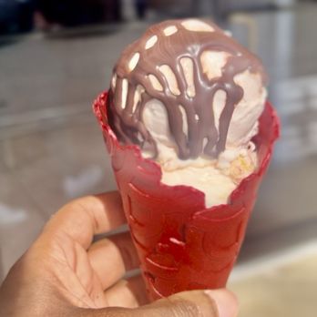 Flower & Cream - Red velvet cone with roasted strawberry, raspberry tres leches half scoops, and fudge - Ice Cream & Frozen Yogurt Near Me - Houston, Texas