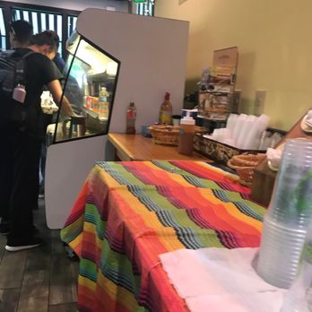 Los Molinos - a man ordering food at a restaurant - Mexican Near Me - Denver, Colorado Los Molinos - a man ordering food at a restaurant - Mexican Near Me - Denver, Colorado