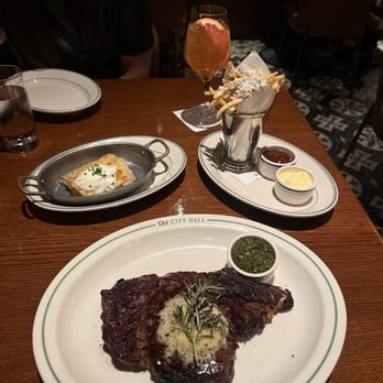 Old City Hall - Bone in Ribeye, Truffle Fries, Grapefruit Spritz - American Near Me - New Braunfels, Texas