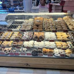 Beiler's Donuts display case of donuts (breads, cakes and baked items are located behind this area. Beiler's Donuts display case of donuts (breads, cakes and baked items are located behind this area.