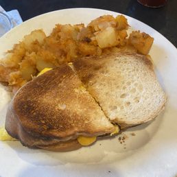 Breakfast sandwich-egg, cheese & hot peppers with hash Browns