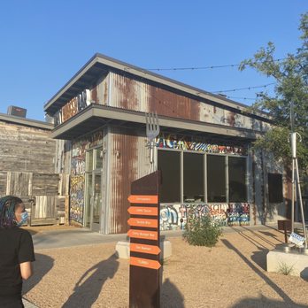 Dirty Burger Bar - a woman standing in front of a building - Burgers Near Me - The Colony, Texas Dirty Burger Bar - a woman standing in front of a building - Burgers Near Me - The Colony, Texas