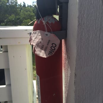 Hatteras Realty - I don't think these fire extinguishers are up to code in the rental Serendipity. - Property Management Near Me - Avon, North Carolina