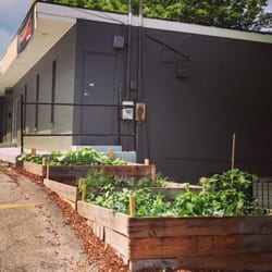 BarreAmped Nashville WEST - The exterior view of the building and ever growing garden.