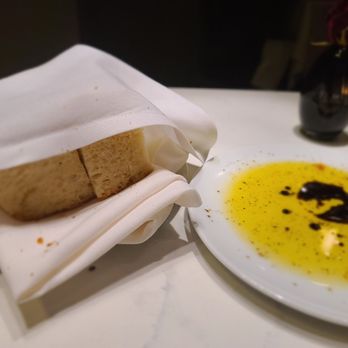 Besa - Bread with olive oil and a little balsamic vinegar - New American Near Me - Detroit, Michigan Besa - Bread with olive oil and a little balsamic vinegar - New American Near Me - Detroit, Michigan