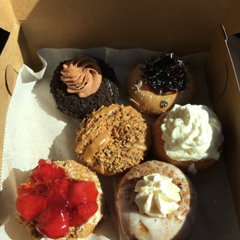 Doughology - Lynbrook - Top to bottom, left to right: Nutella, PB&J, Samoa, Cheesecake, Strawberry crumb cake, French toast. - Donuts Near Me - Lynbrook, New York Doughology - Lynbrook - Top to bottom, left to right: Nutella, PB&J, Samoa, Cheesecake, Strawberry crumb cake, French toast. - Donuts Near Me - Lynbrook, New York