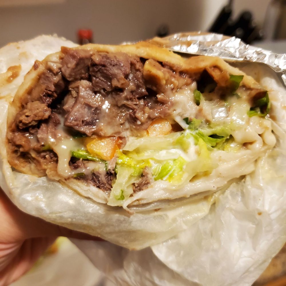 El Pulpo Loco - Cross section of lengua burrito - Mexican Near Me - Chicago, Illinois El Pulpo Loco - Cross section of lengua burrito - Mexican Near Me - Chicago, Illinois
