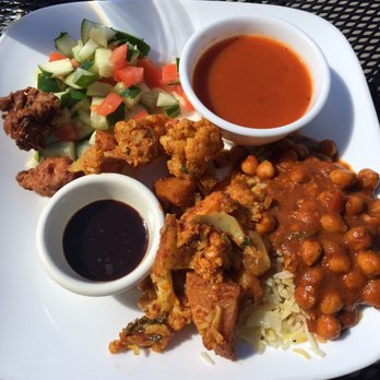 India Grill indian restaurant and bar - Aloo gobi, lemon rice, channa masala, pakora, lentil tomato soup, and a nice fresh cucumber and tomato salad. - Indian Near Me - Arlington, Texas
