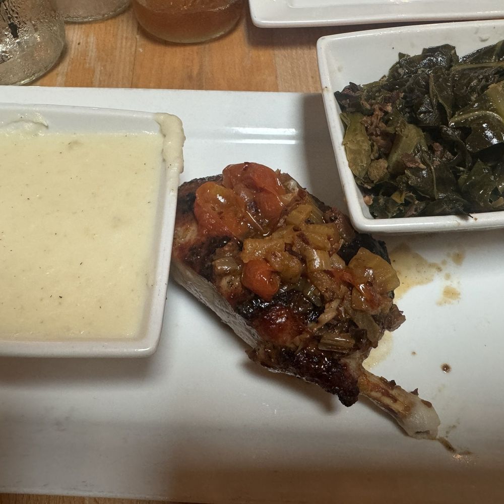 Scratch Kitchen & Taproom - Bone-in pork chop with creamy mashed potatoes and collard greens - Bars Near Me - Apex, North Carolina Scratch Kitchen & Taproom - Bone-in pork chop with creamy mashed potatoes and collard greens - Bars Near Me - Apex, North Carolina