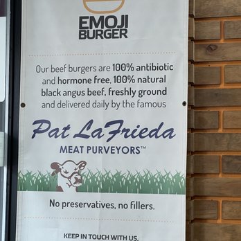 Emoji Burger - a sign on the side of a building - Burgers Near Me - Jackson Heights, New York