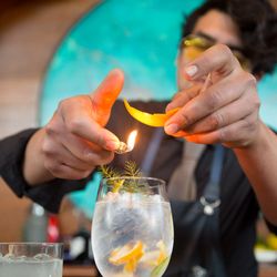 Your Baja Friend - Bartender makes a flaming gin and tonic at Manzanilla in Ensenada, Baja, Mexico.