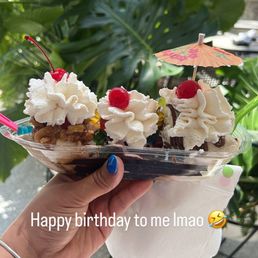 Banana split with coffee, pistachio and cherry ice cream Banana split with coffee, pistachio and cherry ice cream