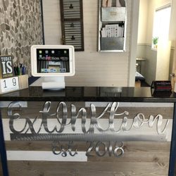 ExtINKtion - Our friendly, knowledgeable staff is ready to serve - book your appointment today!