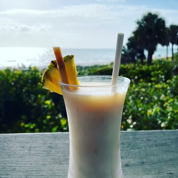 Gumbo Limbo - The epic pina colada with floater in the restaurant area. - Seafood Near Me - Naples, Florida