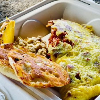 Anuenue Cafe - an omelet and bread - Cafes Near Me - Koloa, Hawaii