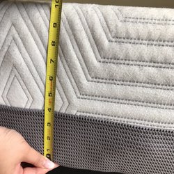 Mattress Firm San Marcos Furniture Row - Salesgirl helping me confirm thickness.