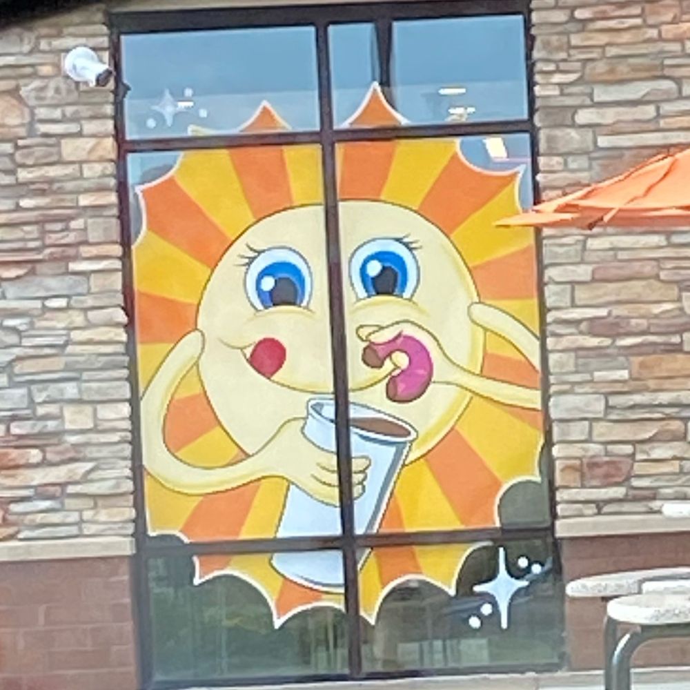 Dunkin' -  a cartoon sun with a glass of juice - Coffee & Tea Near Me - Plymouth, Minnesota