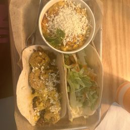 Chorizo taco (left), firecracker shrimp taco (right), corn (top) Chorizo taco (left), firecracker shrimp taco (right), corn (top)