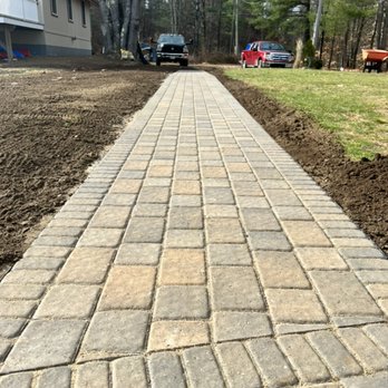 DeWitt Outdoor Services - 60' paver walkway install with landing - Lawn Services Near Me