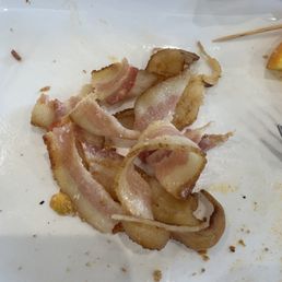 Soggy, barely cooked bacon I removed from my BLT before eating a lettuce and tomato sandwich. Soggy, barely cooked bacon I removed from my BLT before eating a lettuce and tomato sandwich.