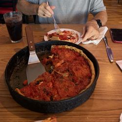 Deep dish medium, pepperoni, sausage, olives, mushrooms, tomatoes