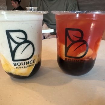 Bounce Boba Lounge - Banana bean with boba and custard cubes on the left, and the strawberry peach tea Fresca on the left. - Juice Bars & Smoothies Near Me - Northridge, California Bounce Boba Lounge - Banana bean with boba and custard cubes on the left, and the strawberry peach tea Fresca on the left. - Juice Bars & Smoothies Near Me - Northridge, California