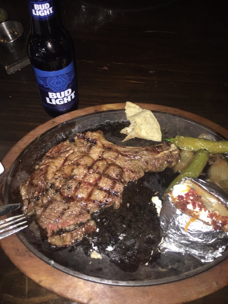 Order 18 oz. Cowboy Cut Rib Eye Steak food online from Parrilla De San Miguel store, Eagle Pass on bringmethat.com