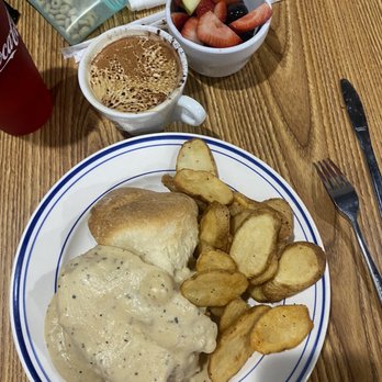 Big Bear Biscuits - HIBERNATOR buttermilk fried chicken, bacon and cheddar cheese, smothered in sawmill gravy Hot Mocha, side of fruit, side of potatoes - Breakfast & Brunch Near Me - Indianapolis, Indiana